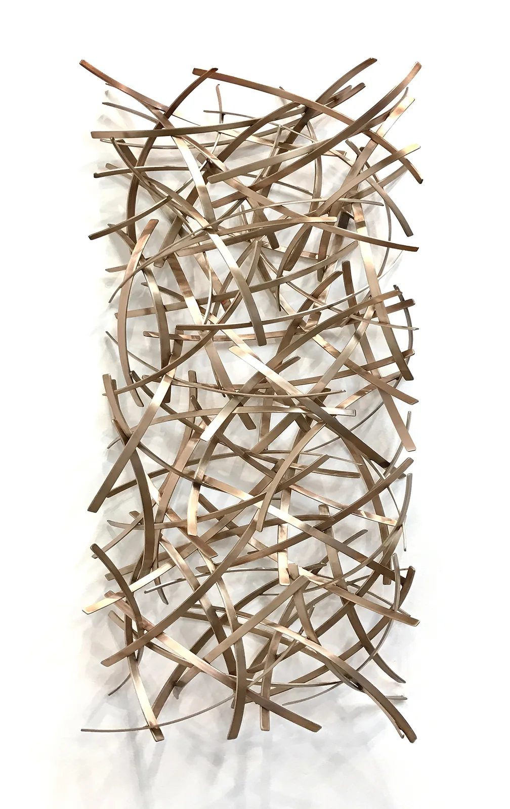 A tall artwork in a residence entry.