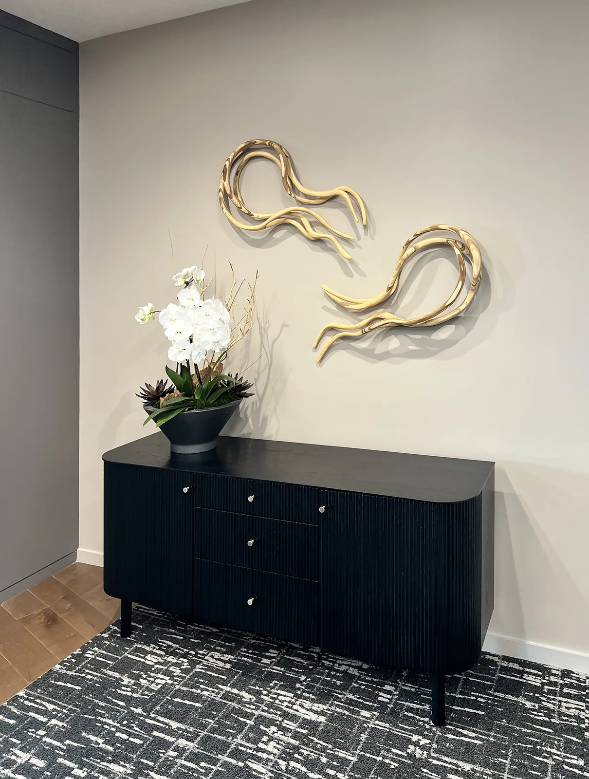 A tall artwork in a Mintz interior.